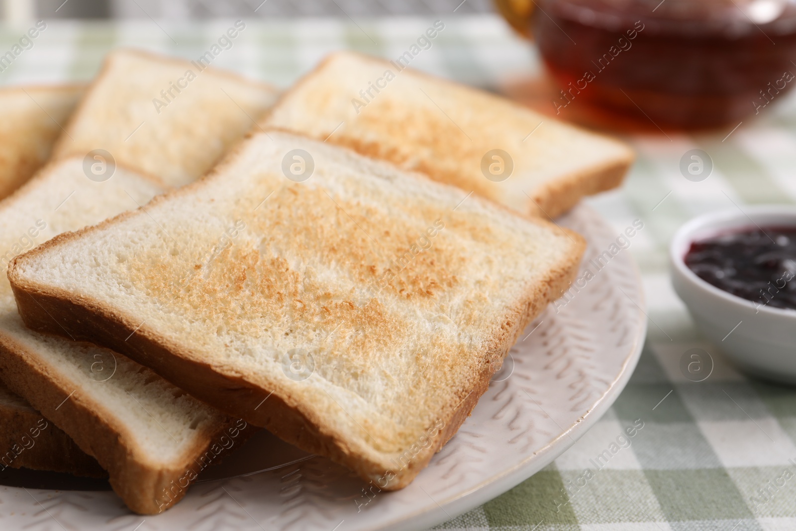 Tasty crispy toasted bread slices on table, closeup Photo of Tasty crispy toasted bread slices on table, closeup
