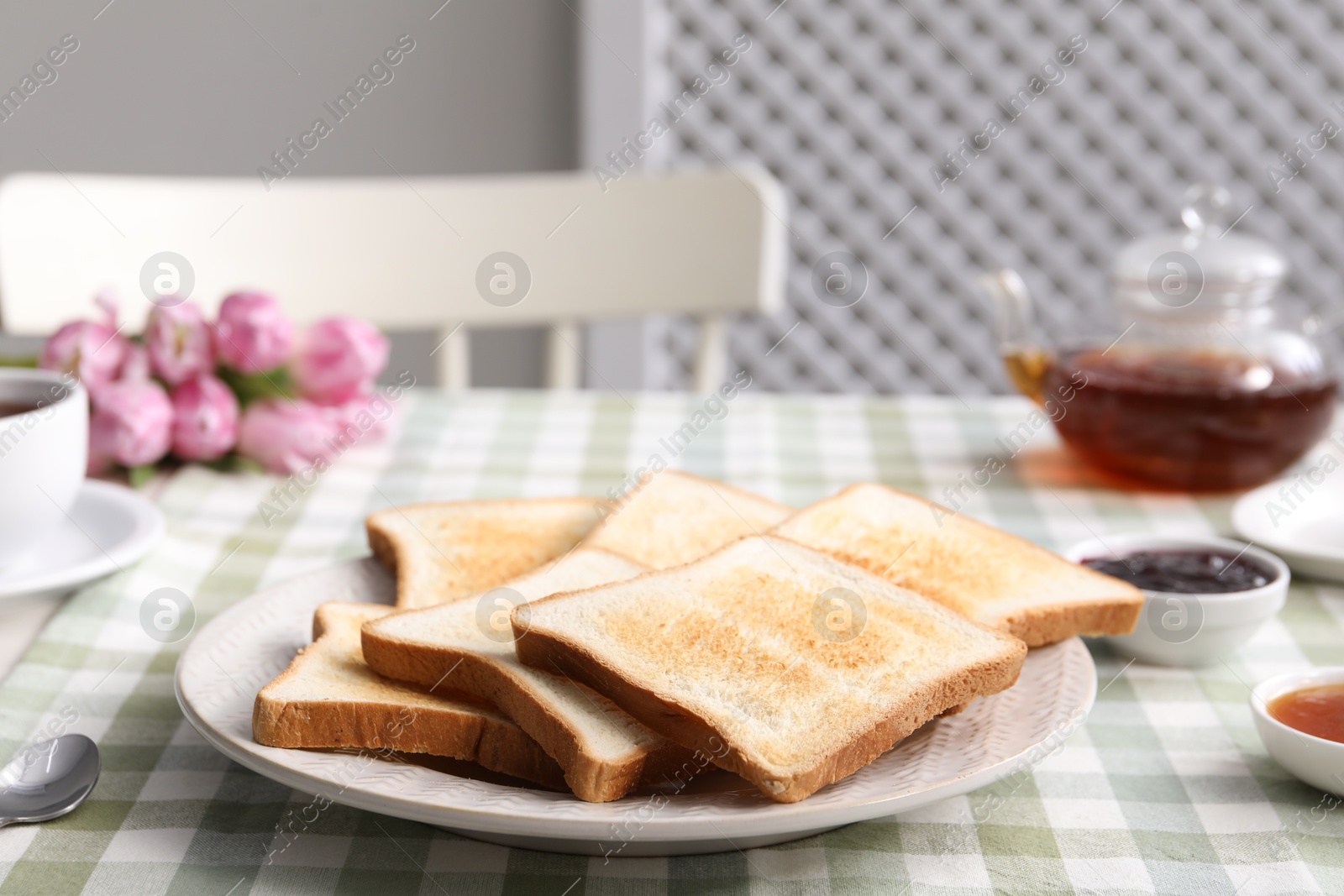 Tasty crispy toasted bread slices on table Photo of Tasty crispy toasted bread slices on table