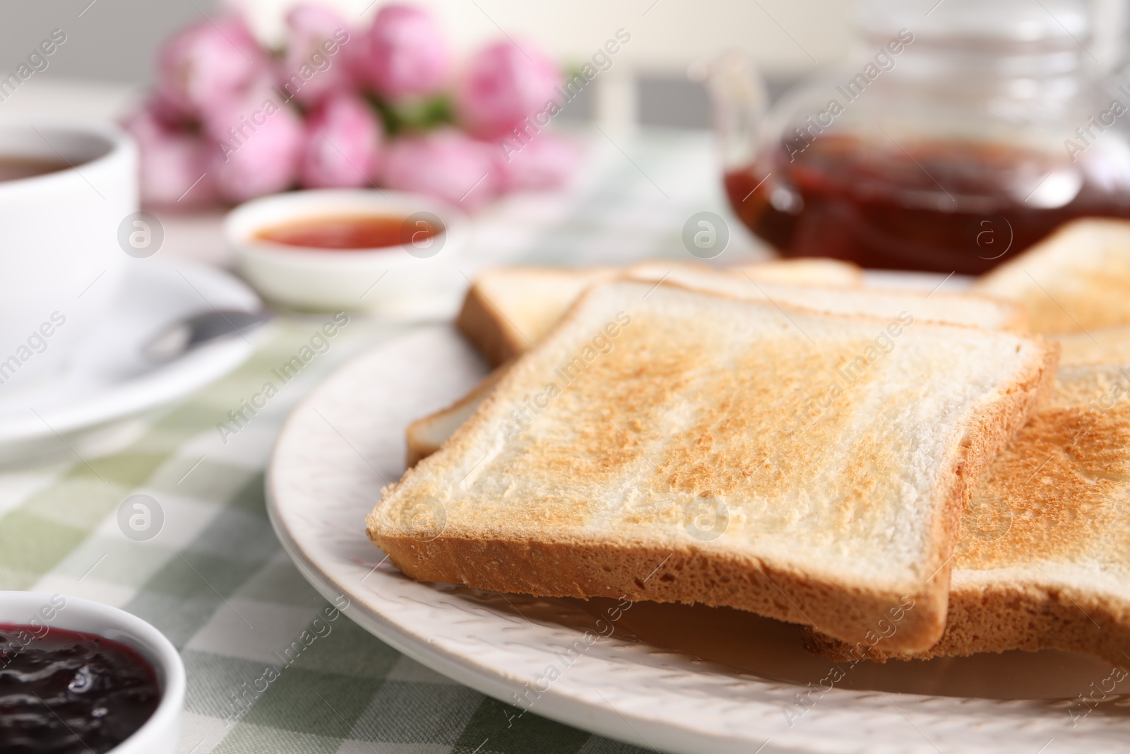 Tasty crispy toasted bread slices on table, closeup Photo of Tasty crispy toasted bread slices on table, closeup