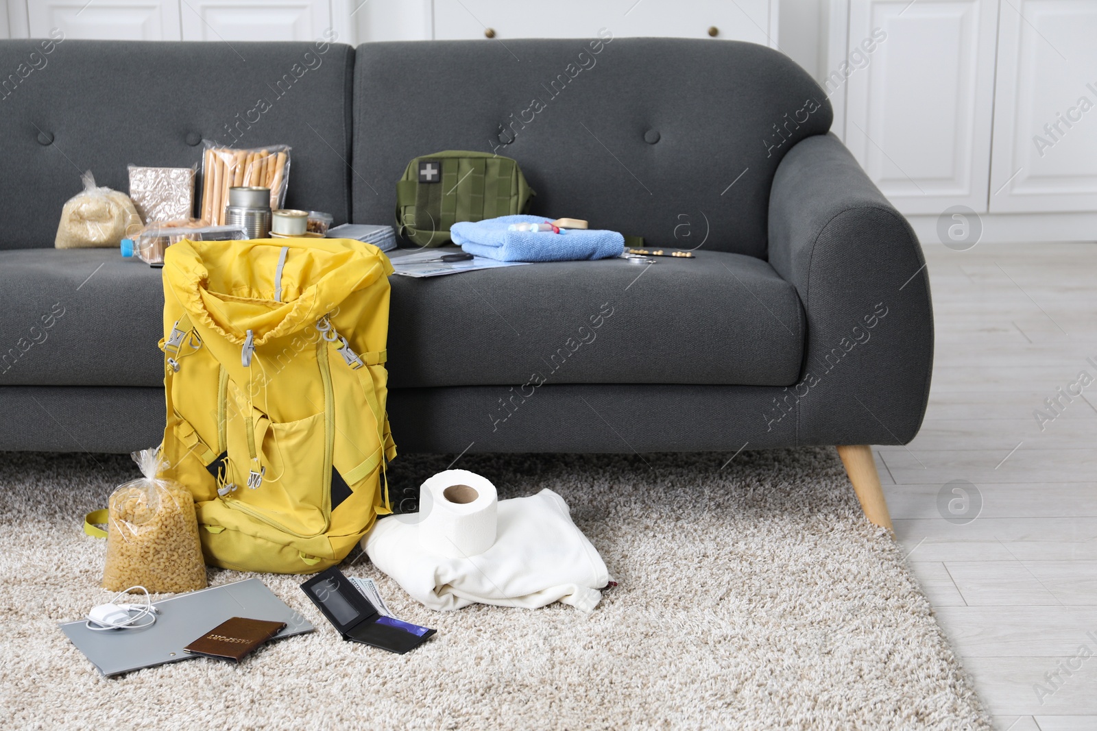 Survival kit. Different emergency supplies at home Photo of Survival kit. Different emergency supplies at home