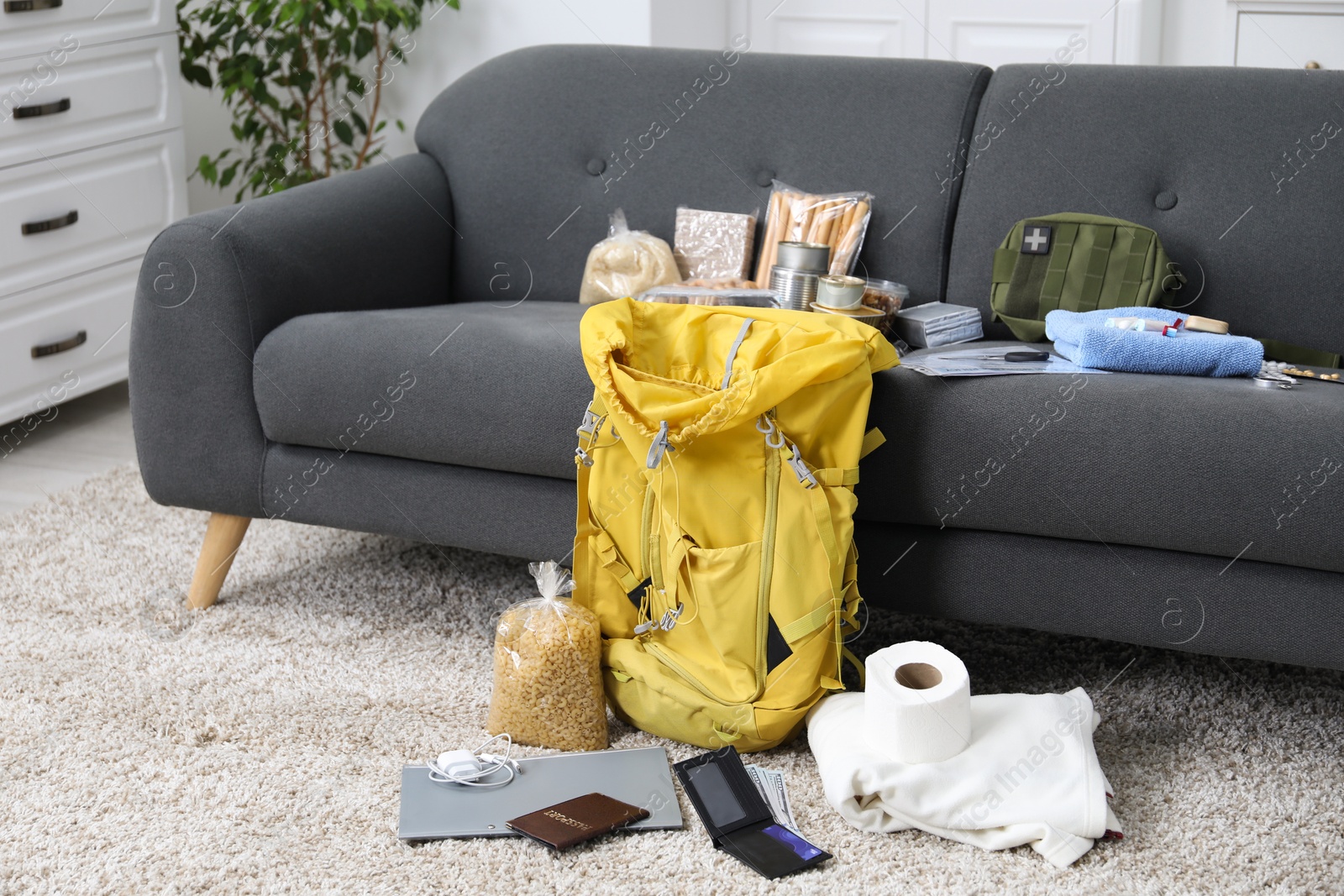 Survival kit. Different emergency supplies at home Photo of Survival kit. Different emergency supplies at home