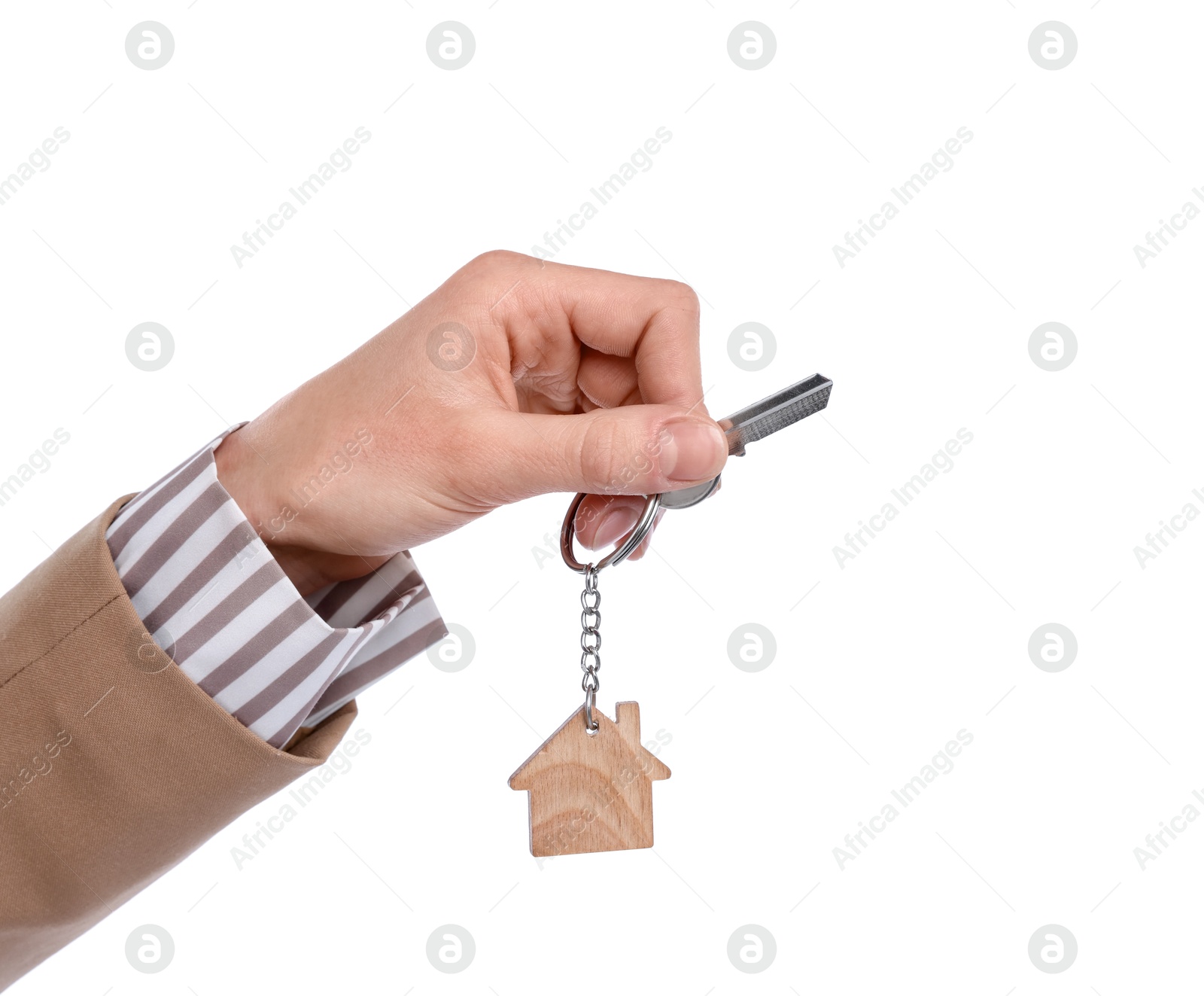 Real estate agent holding key with house shaped keychain on white background, closeup Photo of Real estate agent holding key with house shaped keychain on white background, closeup