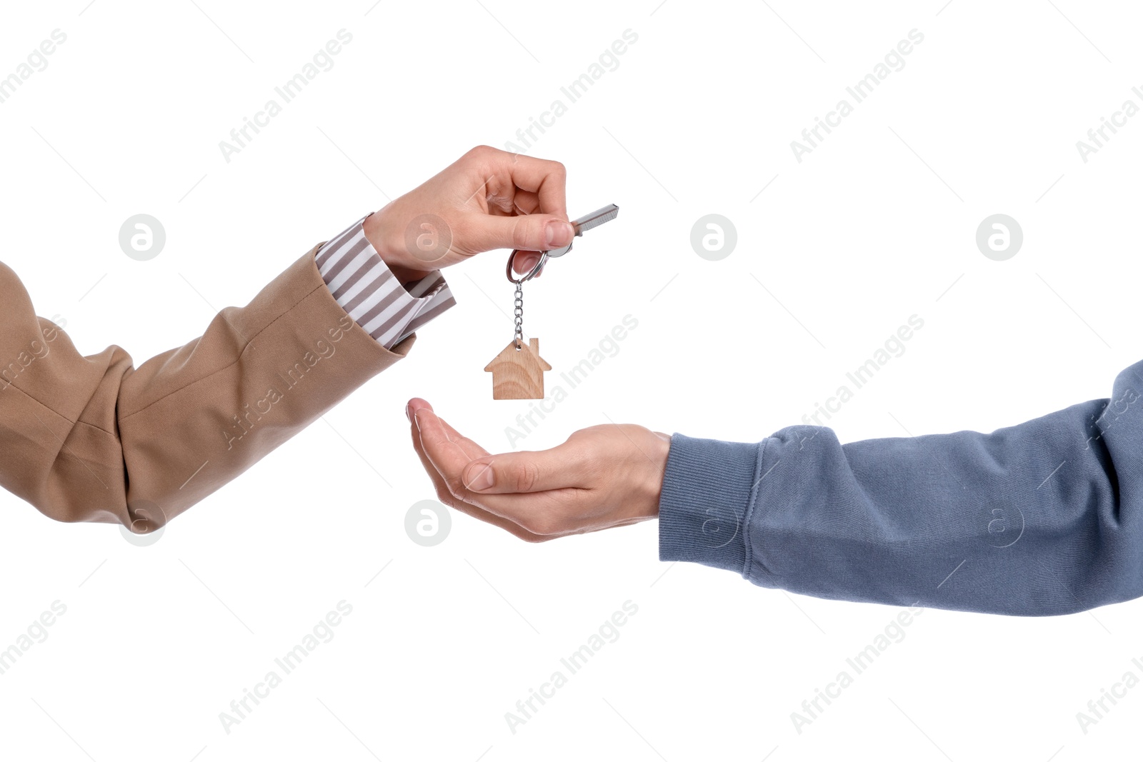 Real estate agent giving house key to new owner on white background, closeup Photo of Real estate agent giving house key to new owner on white background, closeup