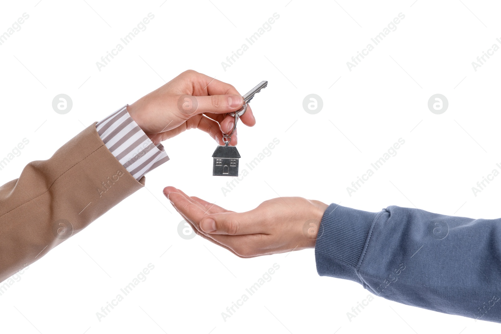 Real estate agent giving house key to new owner on white background, closeup Photo of Real estate agent giving house key to new owner on white background, closeup