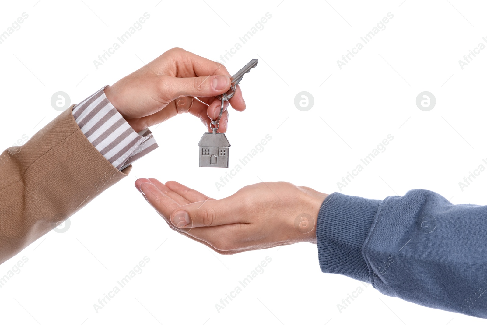 Real estate agent giving house key to new owner on white background, closeup Photo of Real estate agent giving house key to new owner on white background, closeup