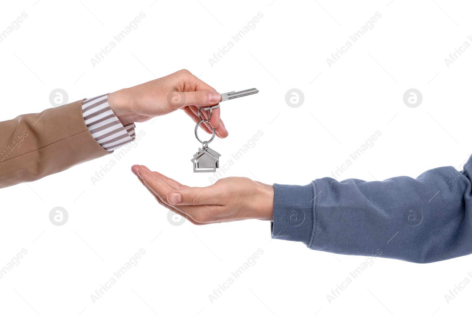 Real estate agent giving house key to new owner on white background, closeup Photo of Real estate agent giving house key to new owner on white background, closeup