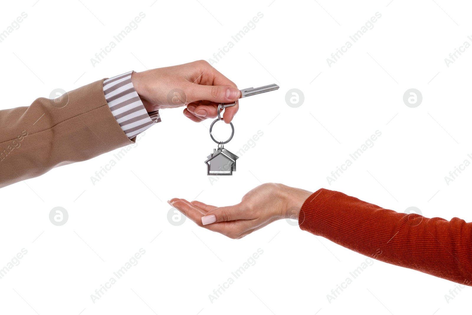 Real estate agent giving house key to new owner on white background, closeup Photo of Real estate agent giving house key to new owner on white background, closeup