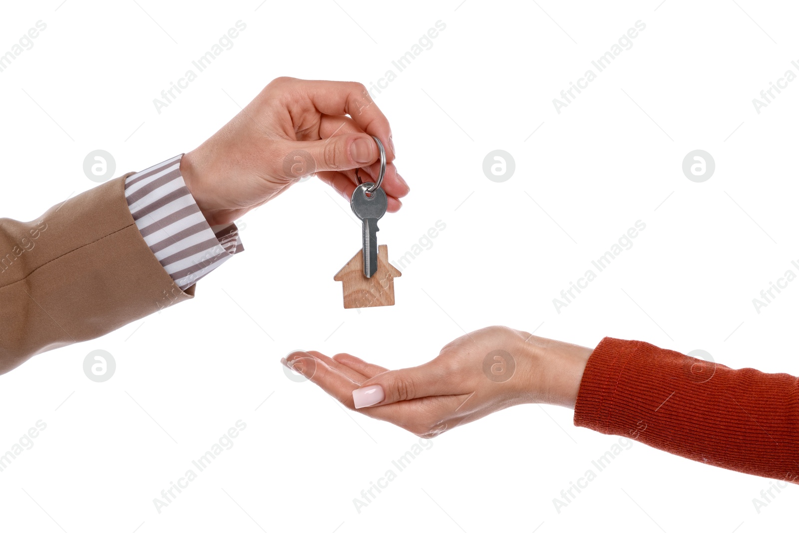 Real estate agent giving house key to new owner on white background, closeup Photo of Real estate agent giving house key to new owner on white background, closeup