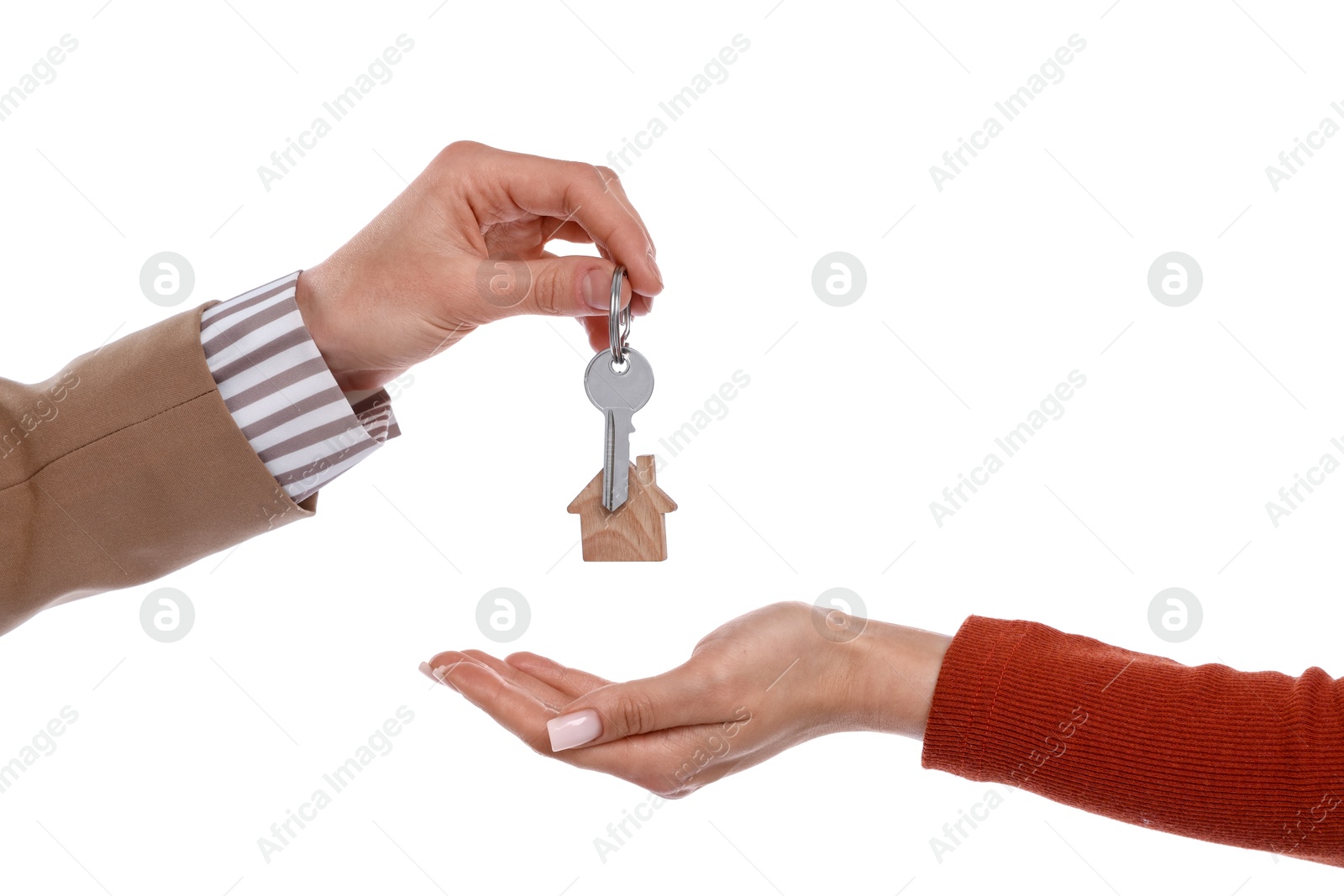 Real estate agent giving house key to new owner on white background, closeup Photo of Real estate agent giving house key to new owner on white background, closeup