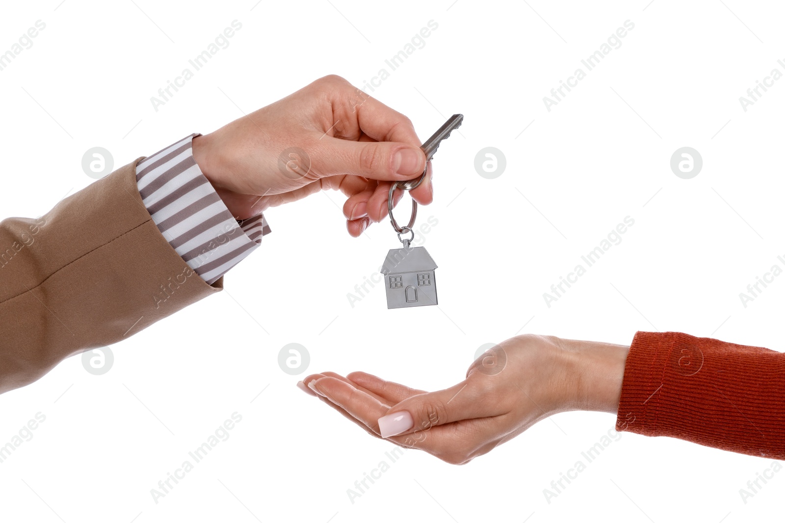 Real estate agent giving house key to new owner on white background, closeup Photo of Real estate agent giving house key to new owner on white background, closeup