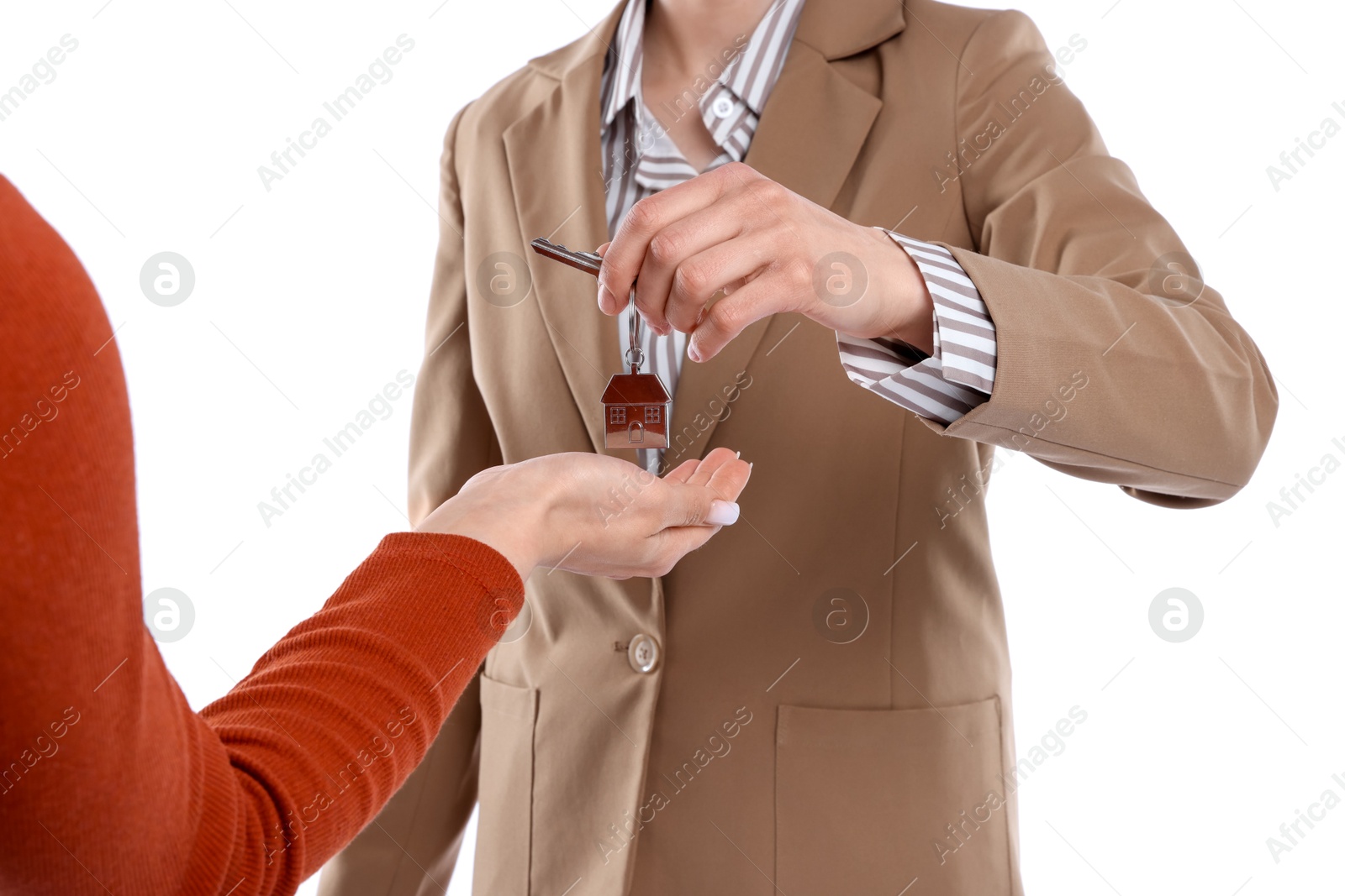 Real estate agent giving house key to new owner on white background, closeup Photo of Real estate agent giving house key to new owner on white background, closeup