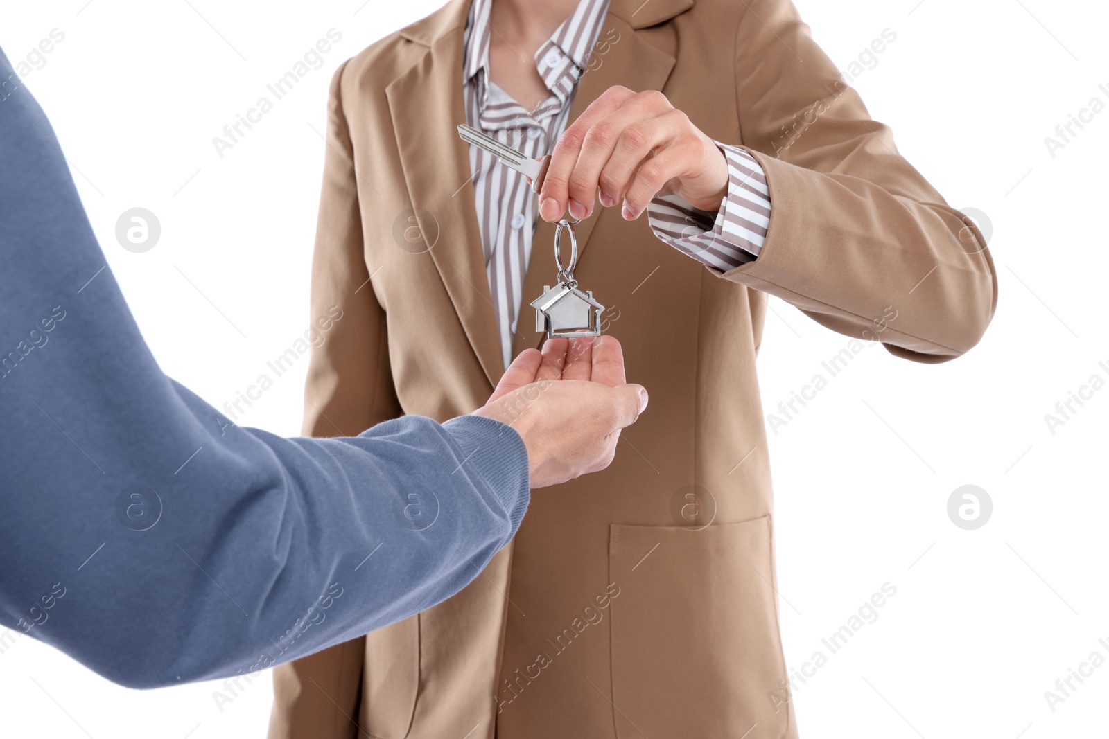 Real estate agent giving house key to new owner on white background, closeup Photo of Real estate agent giving house key to new owner on white background, closeup
