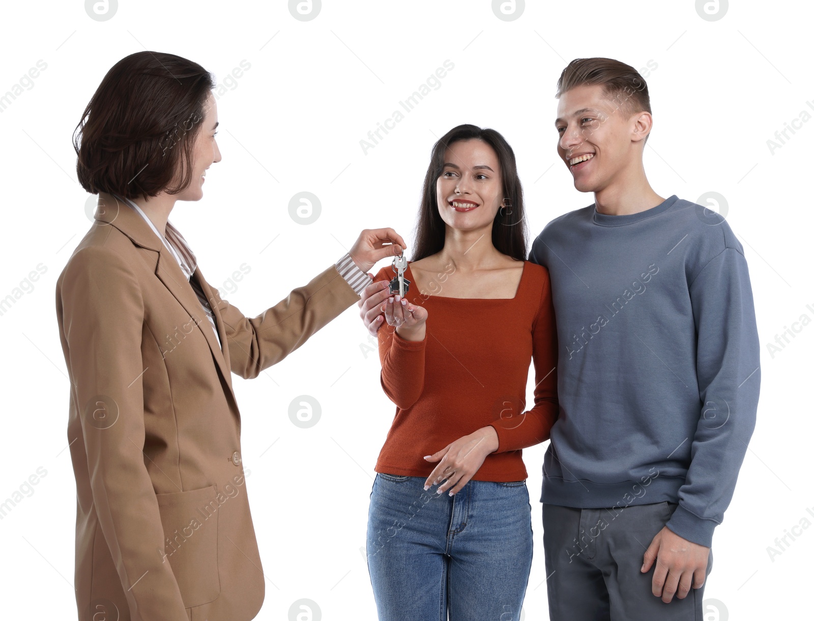 Real estate agent giving house key to new owners on white background Photo of Real estate agent giving house key to new owners on white background