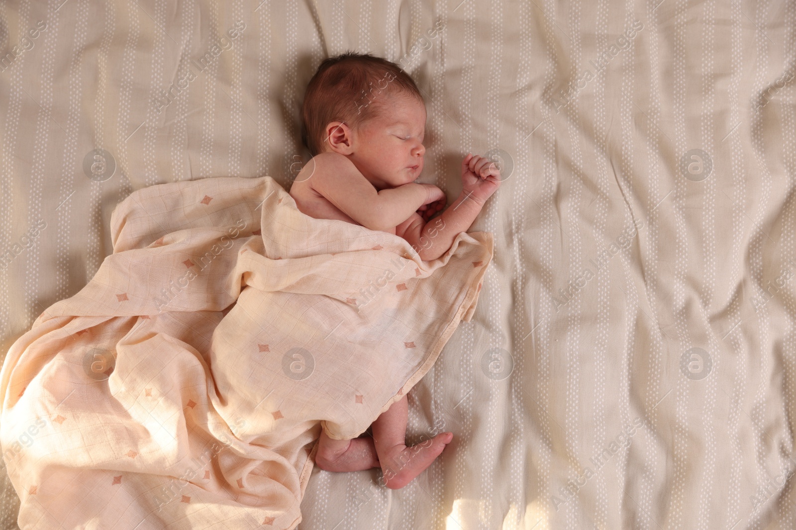 Bedtime. Cute little baby sleeping in bed indoors, top view Photo of Bedtime. Cute little baby sleeping in bed indoors, top view