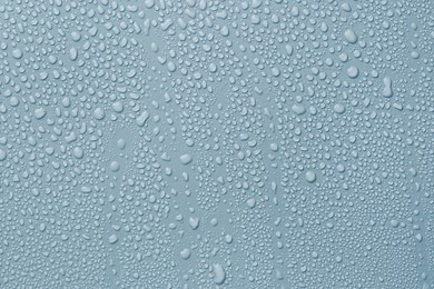 Image of Many water drops on light blue background