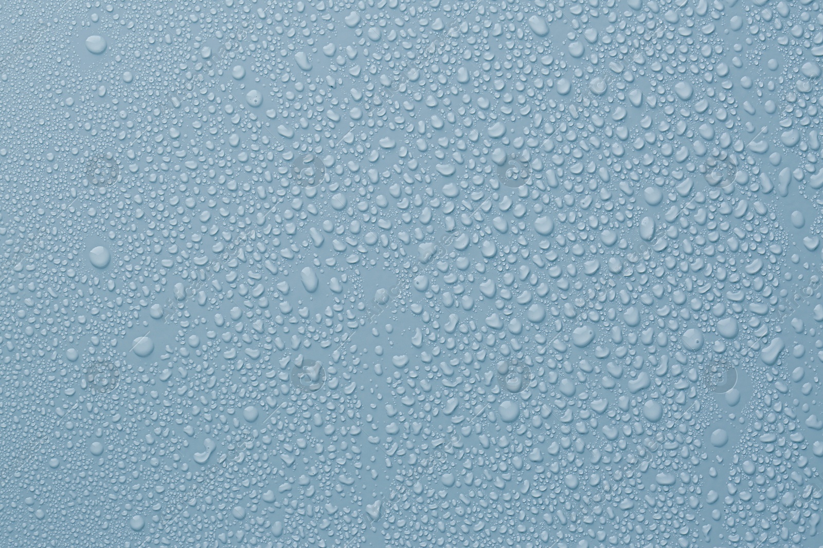 Many water drops on light blue background Image of Many water drops on light blue background
