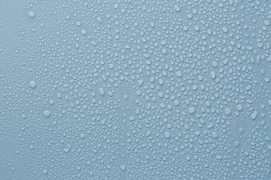 Image of Many water drops on light blue background
