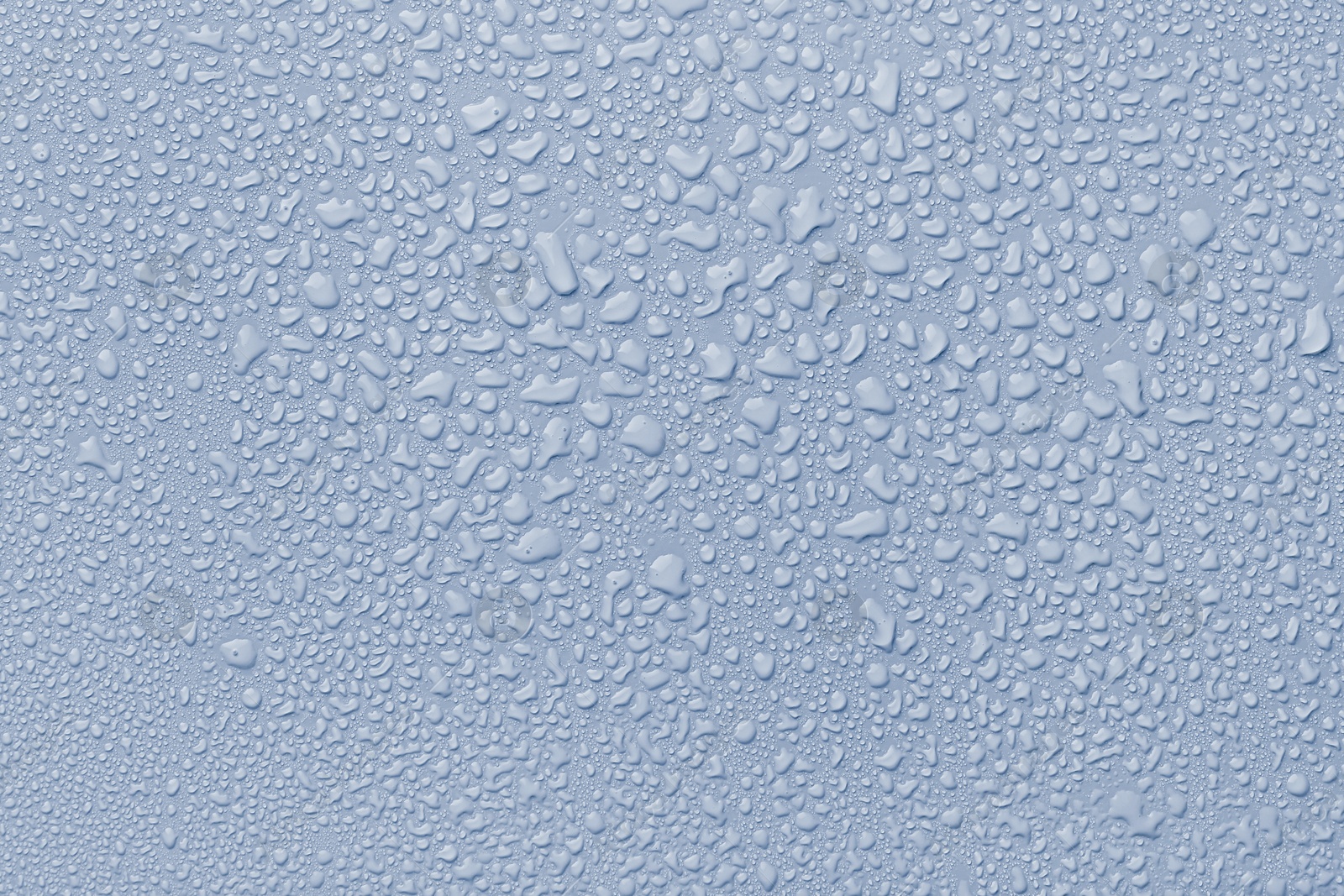 Image of Many water drops on light blue background