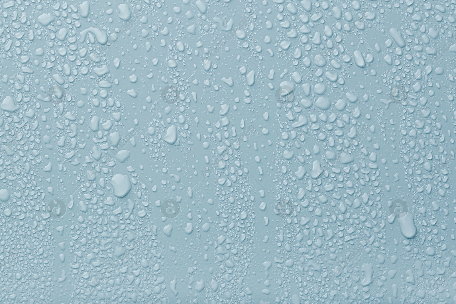 Many water drops on light blue background Image of Many water drops on light blue background
