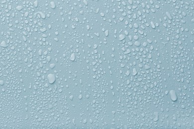 Image of Many water drops on light blue background