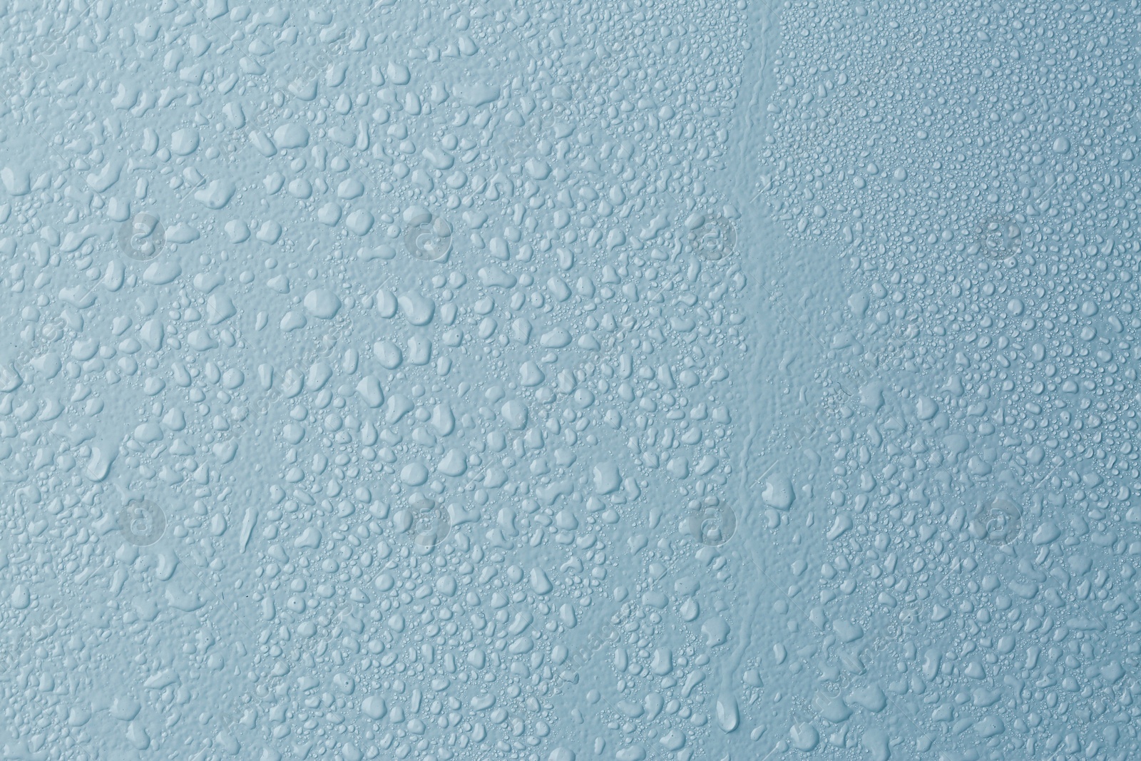 Many water drops on light blue background Image of Many water drops on light blue background