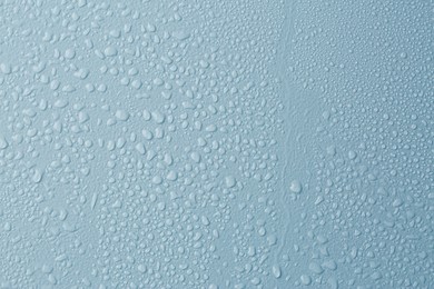 Image of Many water drops on light blue background