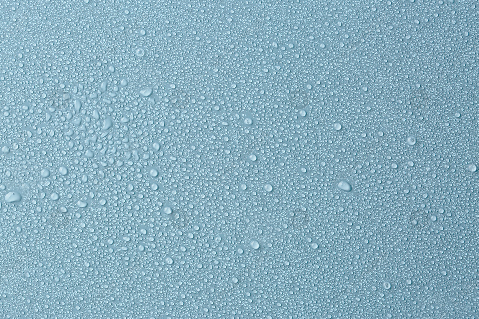Many water drops on light blue background Image of Many water drops on light blue background