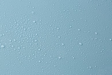 Image of Many water drops on light blue background