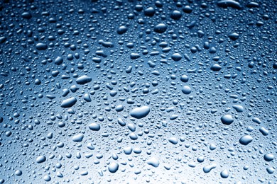 Image of Many water drops on glass surface, closeup