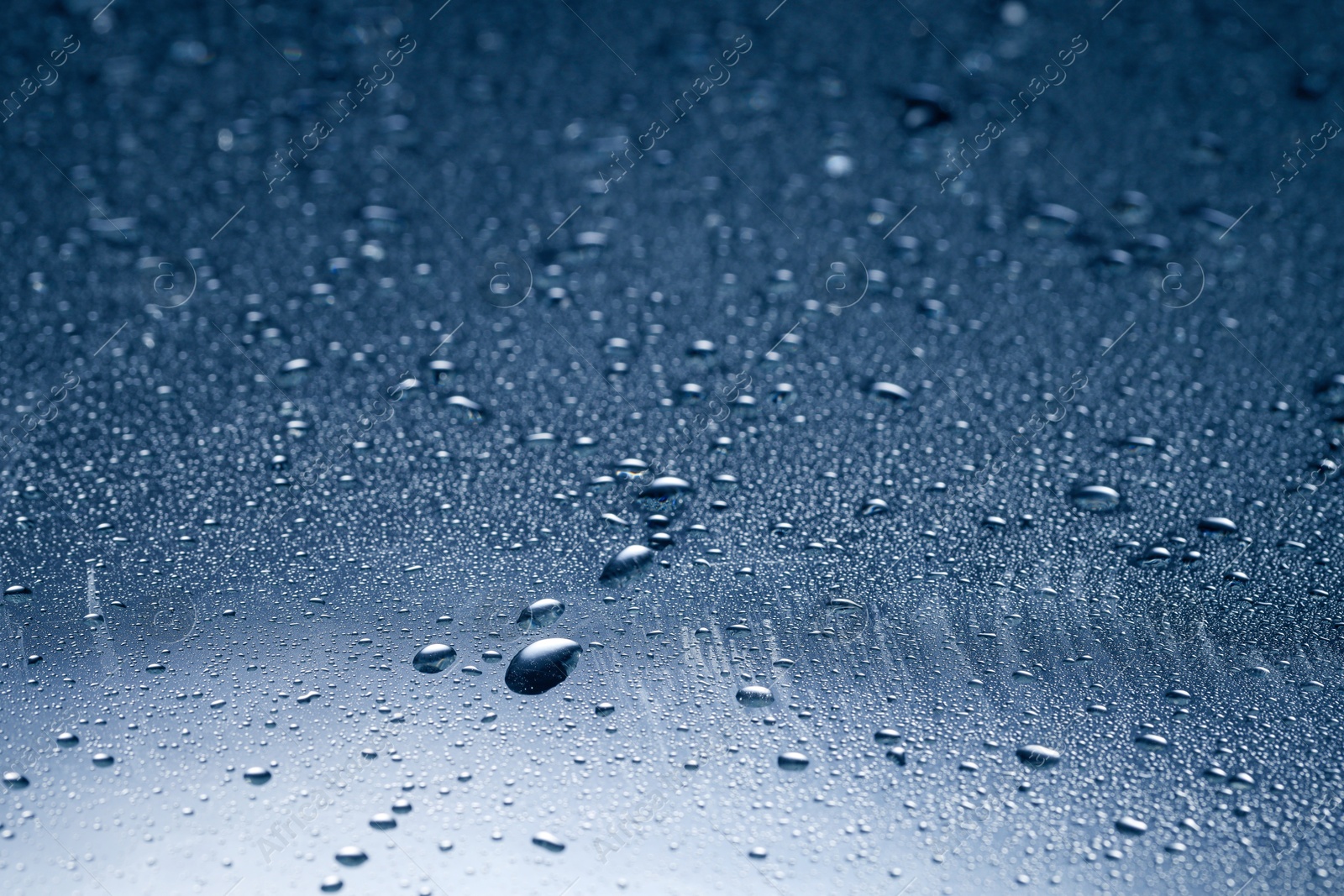 Image of Many water drops on glass surface, closeup