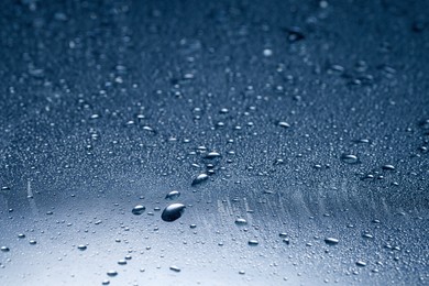 Image of Many water drops on glass surface, closeup