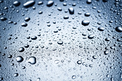 Image of Many water drops on glass surface, closeup