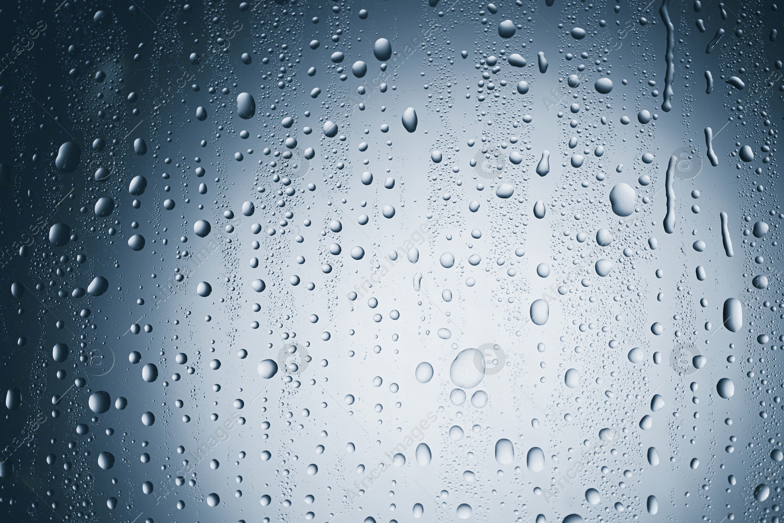 Many water drops on glass surface, closeup Image of Many water drops on glass surface, closeup