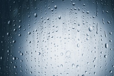 Image of Many water drops on glass surface, closeup