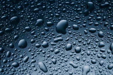 Image of Many water drops on glass surface, closeup