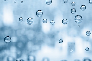 Image of Soda water with bubbles in glass, closeup