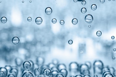 Image of Soda water with bubbles in glass, closeup