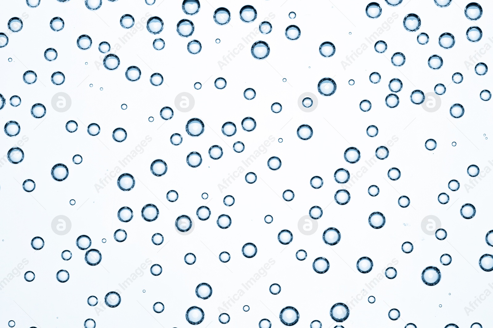 Soda water with bubbles as background, closeup Image of Soda water with bubbles as background, closeup