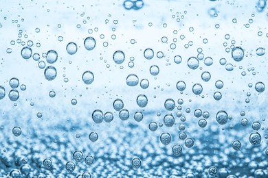 Image of Soda water with bubbles as background, closeup