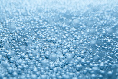 Image of Soda water with bubbles as background, closeup