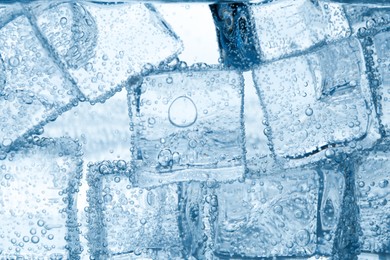 Image of Soda water with ice cubes as background, closeup