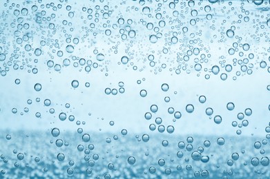 Image of Soda water with bubbles as background, closeup