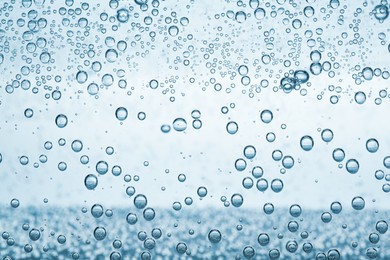 Image of Soda water with bubbles as background, closeup