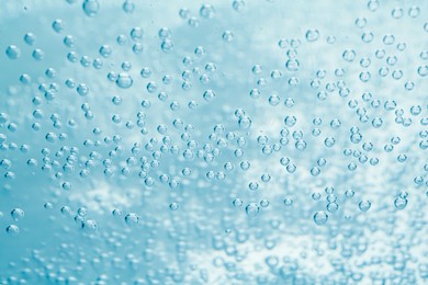 Image of Soda water with bubbles as background, closeup
