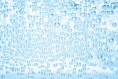Image of Soda water with bubbles as background, closeup