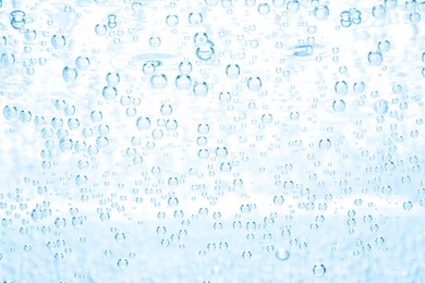Image of Soda water with bubbles as background, closeup