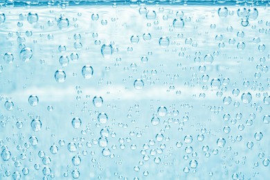Image of Soda water with bubbles as background, closeup
