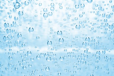 Image of Soda water with bubbles as background, closeup