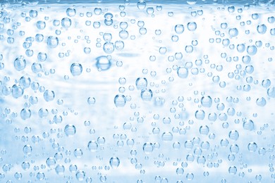 Image of Soda water with bubbles as background, closeup