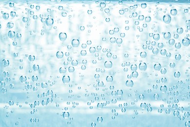 Image of Soda water with bubbles as background, closeup